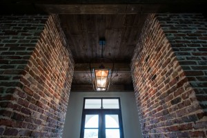 Hardwood ceiling and brick walls