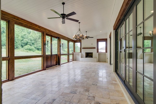 Accordian Doors Lead To Covered Porch With Sliding Barn Wood Doors, Carbine & Assoc.